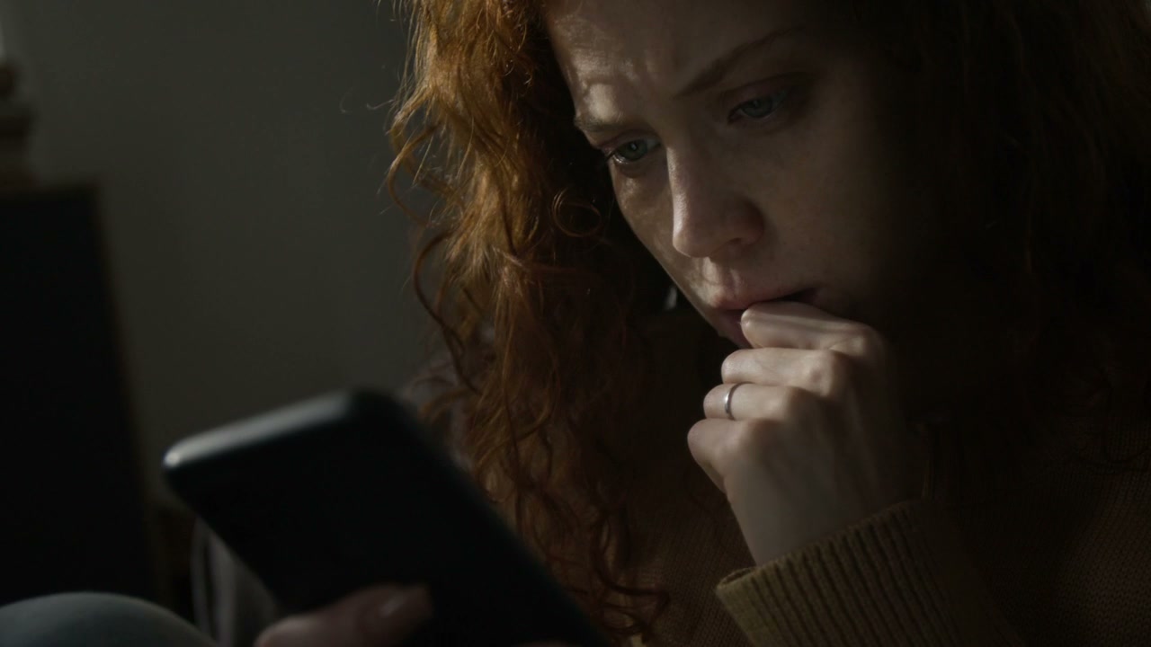 Sad Woman Using Smartphone