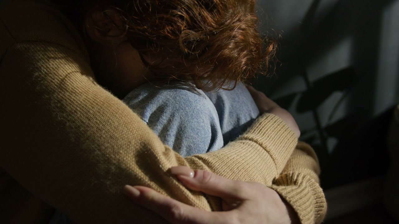 Sad Woman Hugging Knees