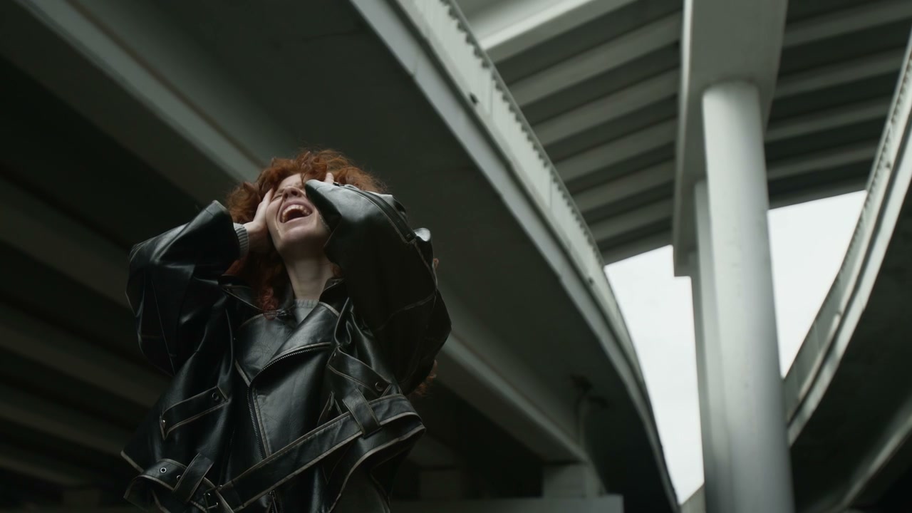 Distressed Woman Under Urban Overpass