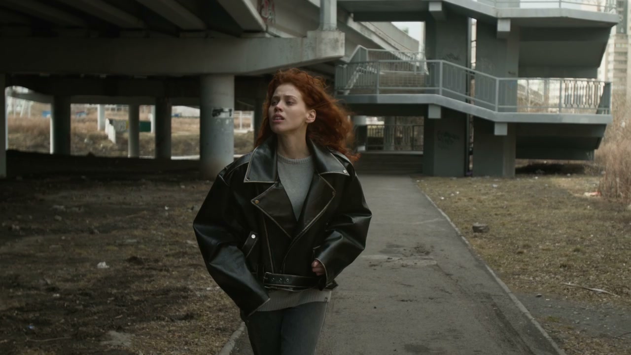 Sad Woman Walking Under Underpass