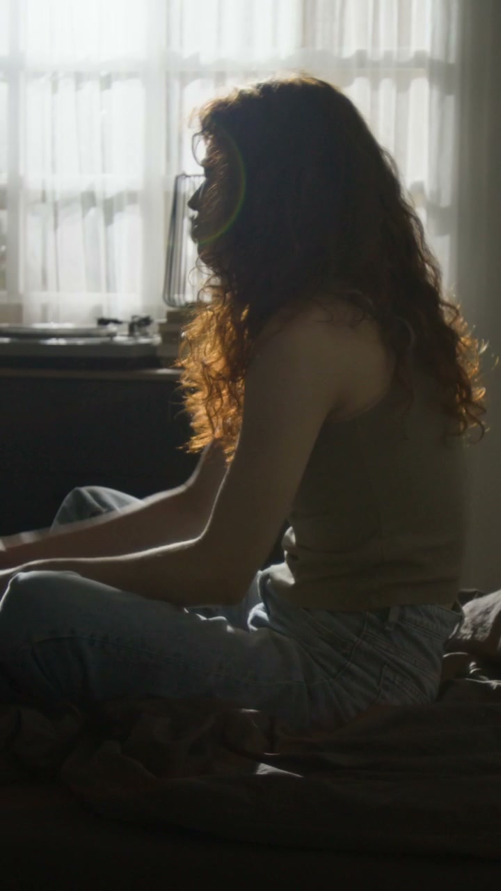 Woman Experiencing Emotional Distress in Bedroom