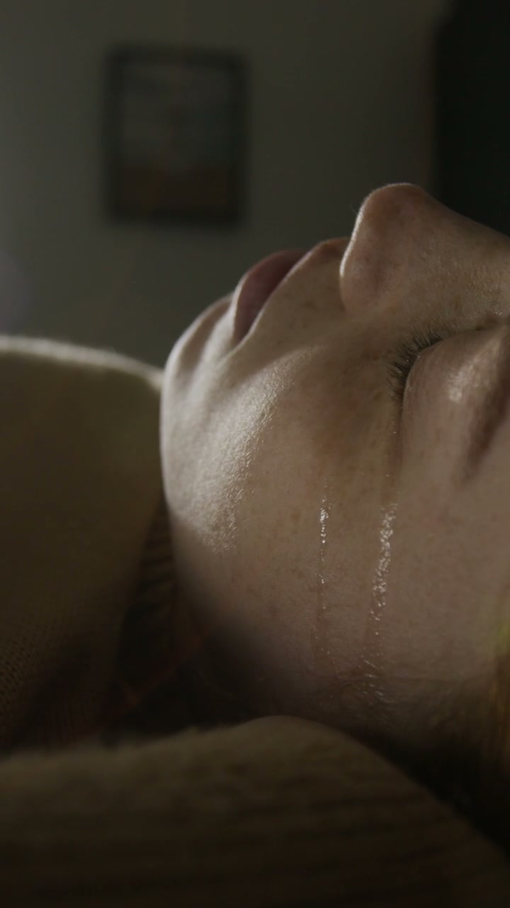 Close-up of Tear Running Down Face of Young and Vulnerable Woman