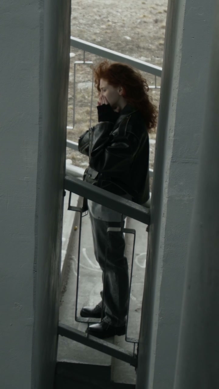 Pensive Person Under Urban Underpass