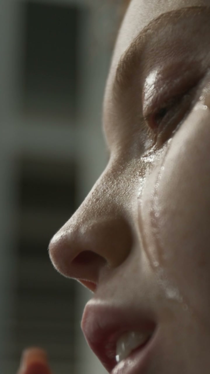 Close Up Profile of Crying Woman