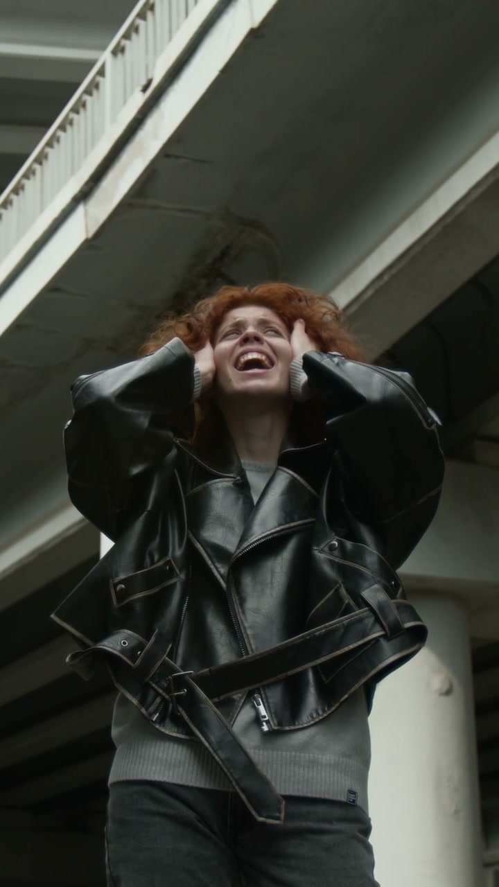 Woman Screaming Under Urban Overpass
