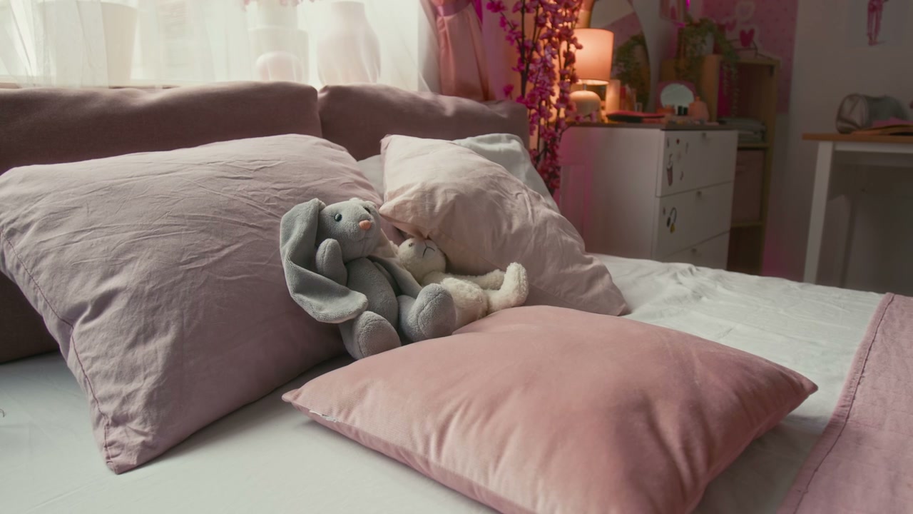 Cozy Pink Bedroom Interior With Stuffed Bunnies