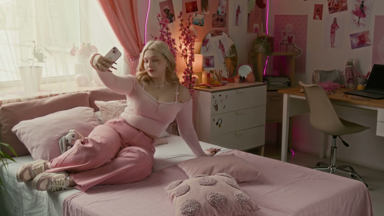 Teenager Taking Selfies in Pink Aesthetic Room