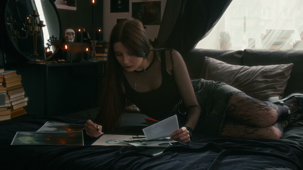 Young Woman Sketching in Goth Bedroom