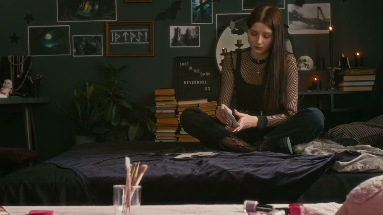 Gothic Teenager Reading Tarot Cards