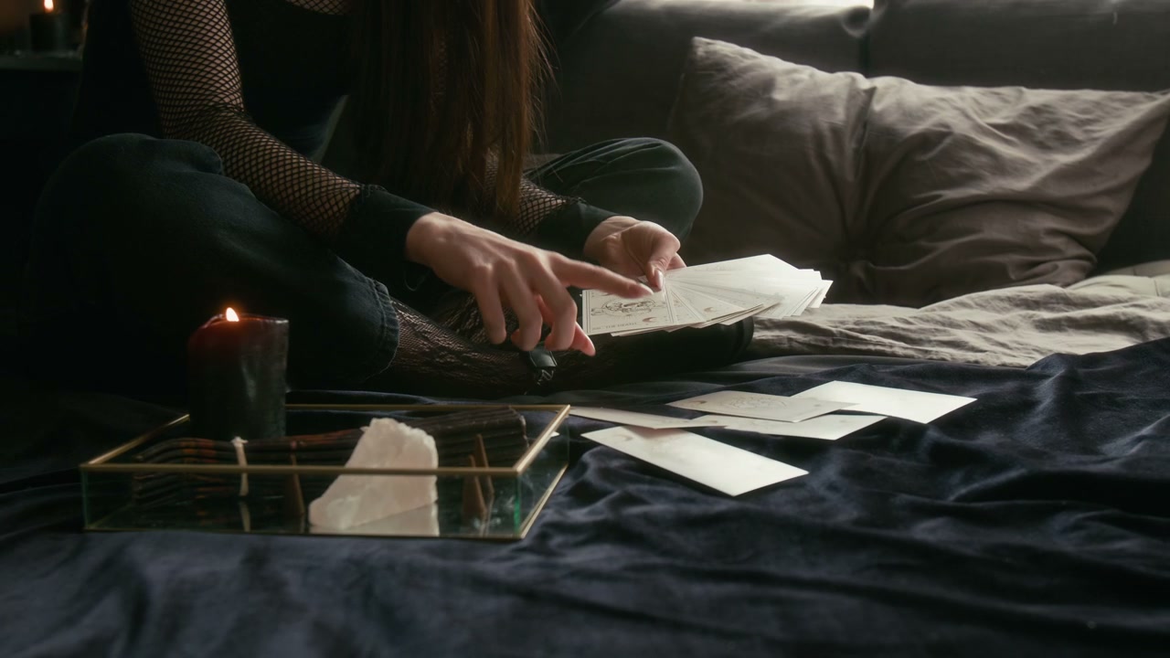 Person Reading Tarot Cards