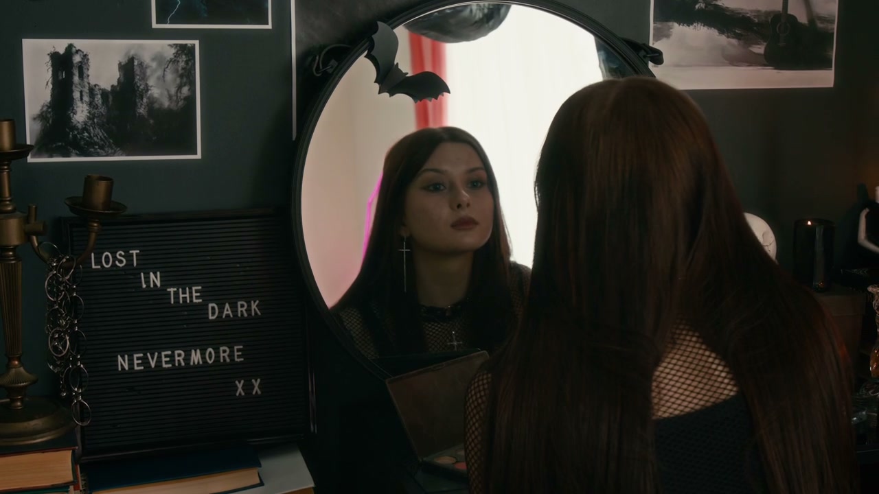Goth Person Applying Makeup in Bedroom Mirror