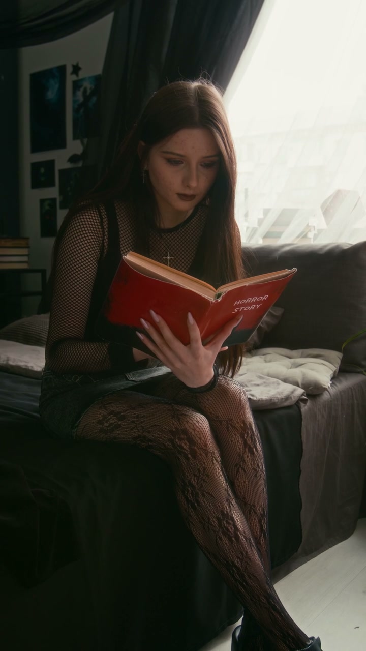 Gothic Teenager Reading Horror Story Book