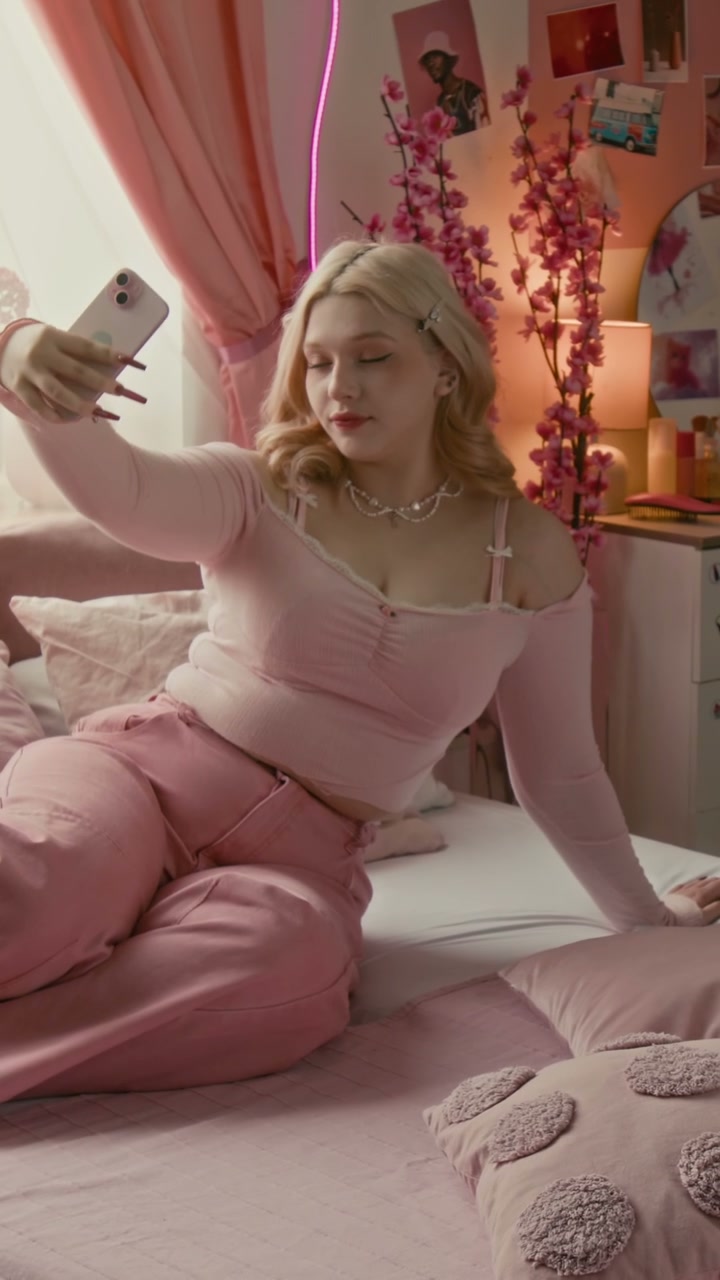 Gen Z Girl Taking Selfie in Pink Bedroom