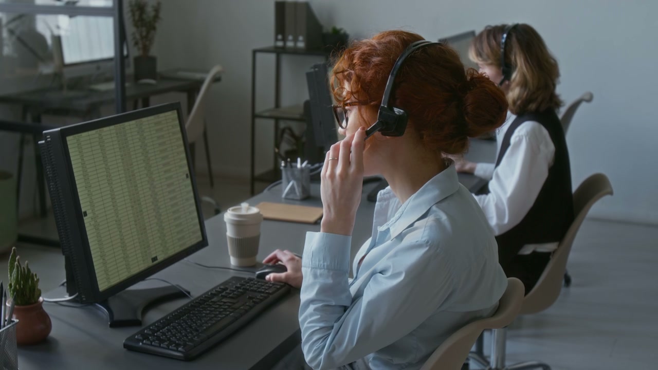 Red-haired Call Center Agent Working