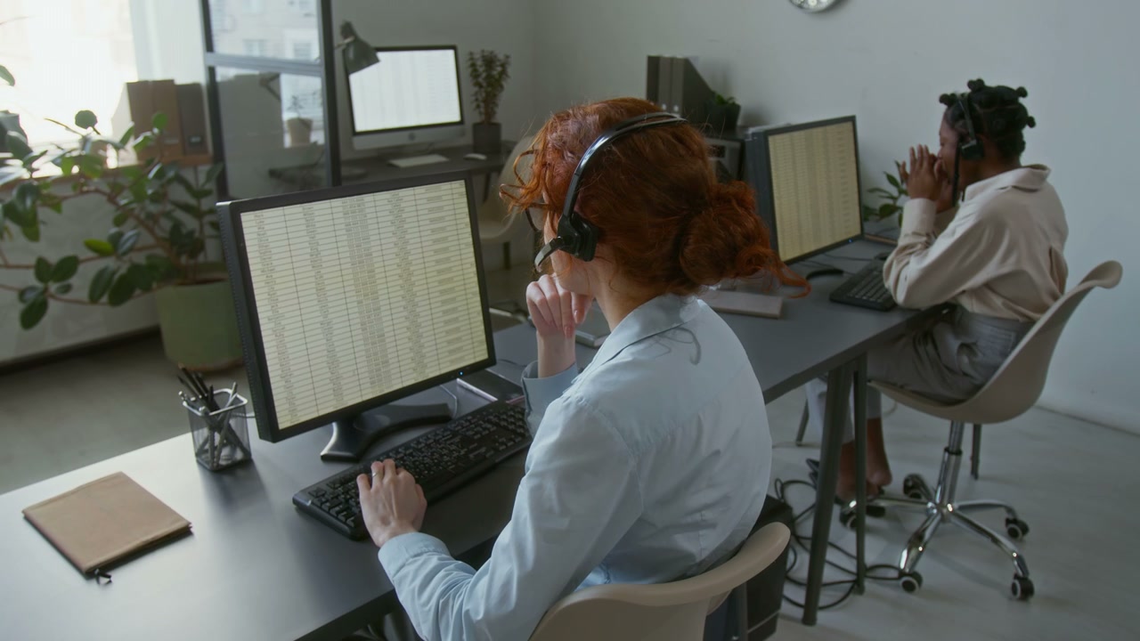 Call Center Agents Working in Modern Office