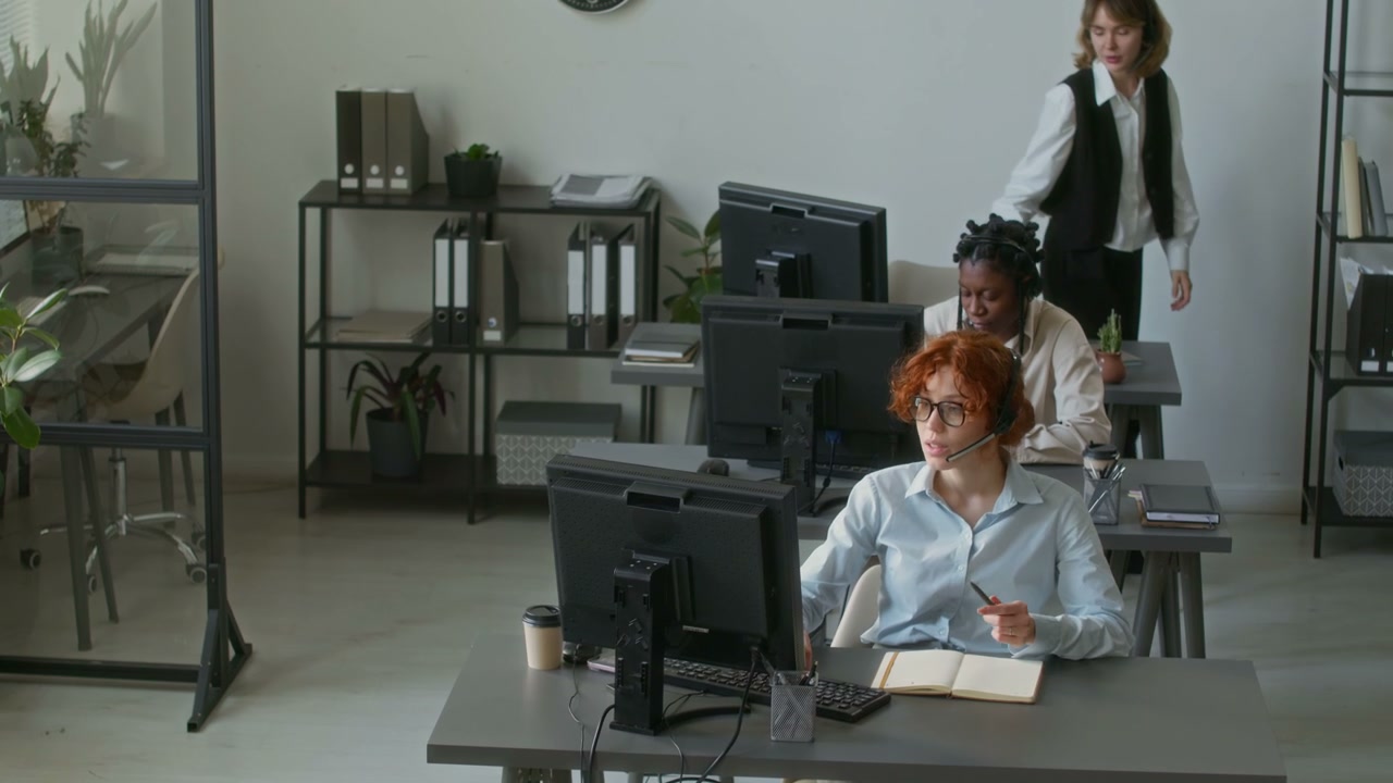Call Center Team Collaborating in Office