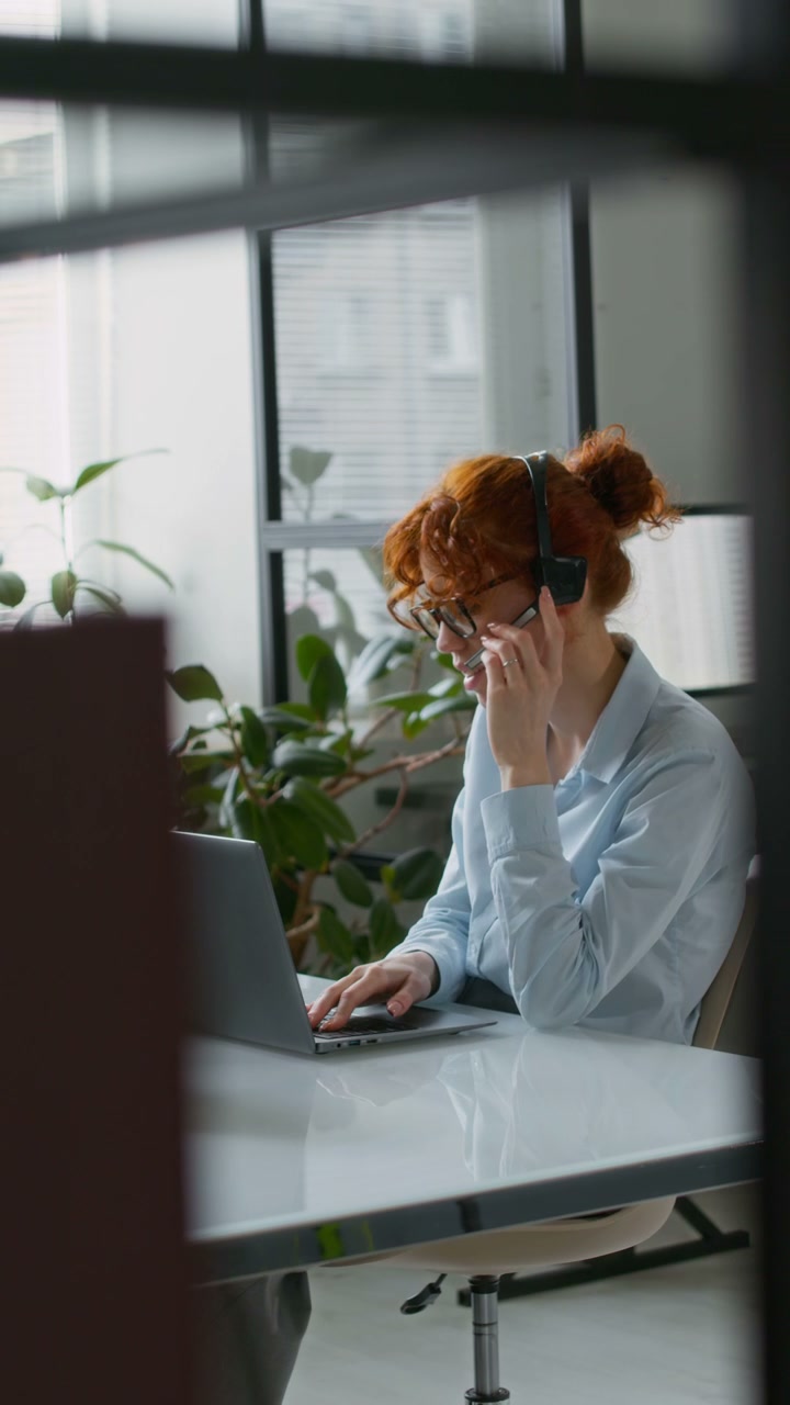 Woman Call Center Agent Working at Laptop