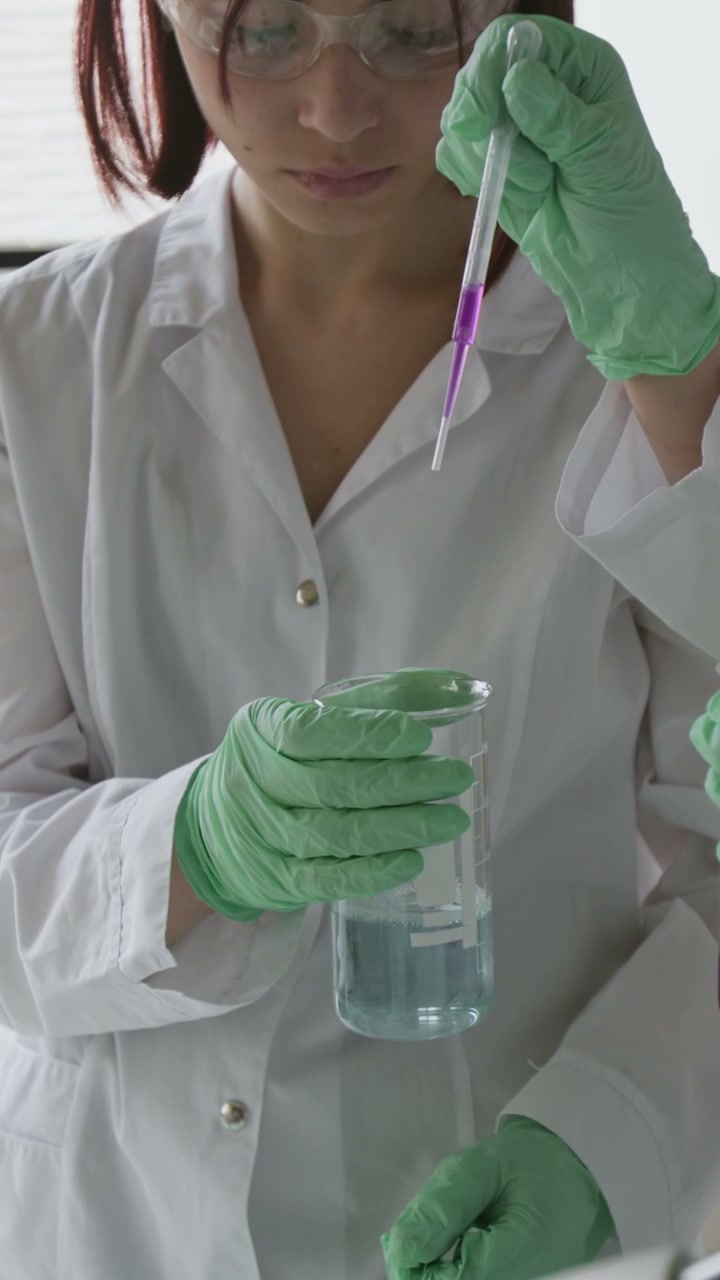 Person Performing Chemistry Experiment