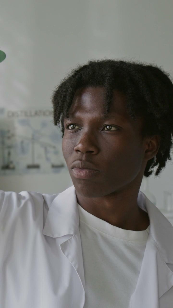 Young Man Smiling In Science Lab