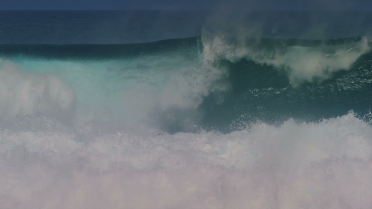 Surfer on Barreling Ocean Wave