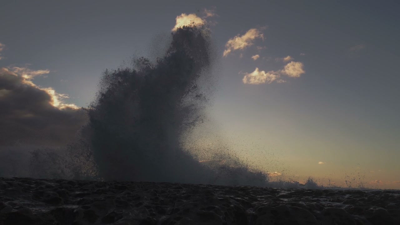 Ocean Wave Splashing at Sunset