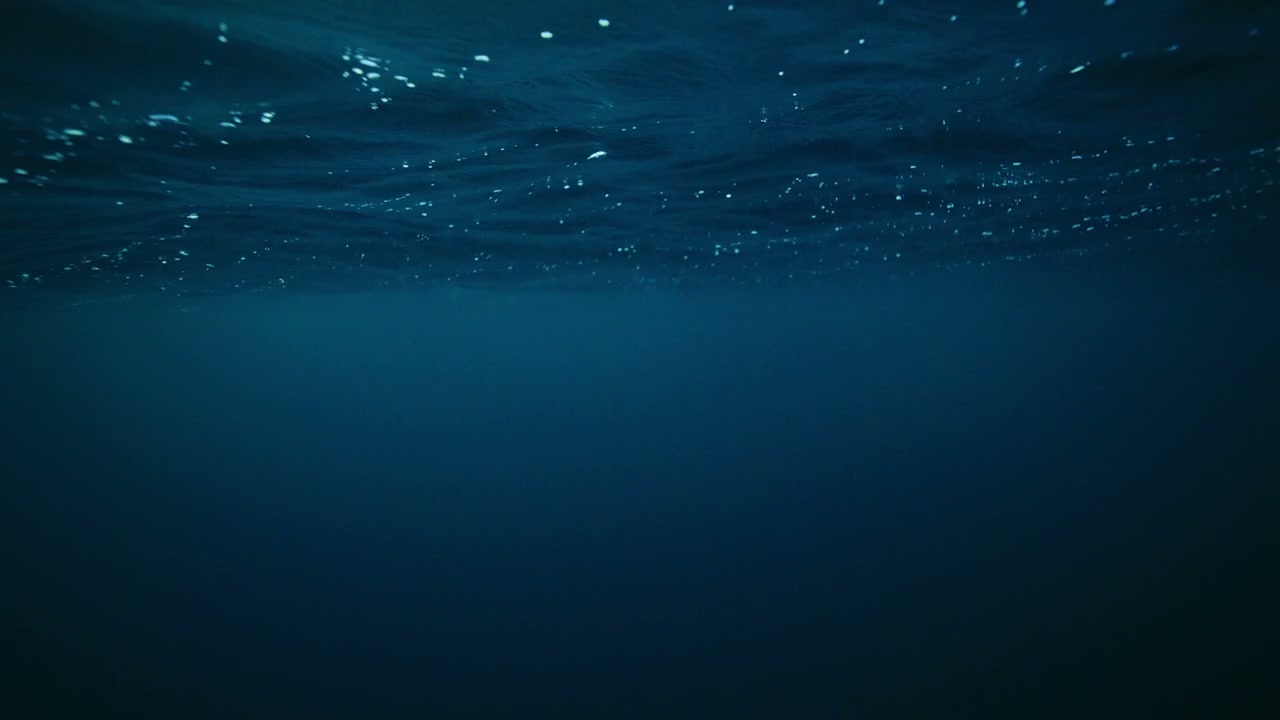 Underwater View of Deep Blue Ocean Waves
