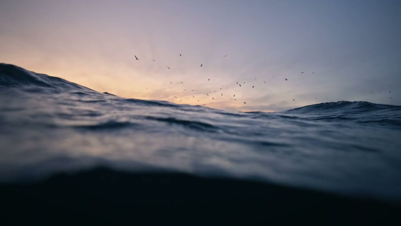Arctic Ocean Surface at Sunset with Mountains