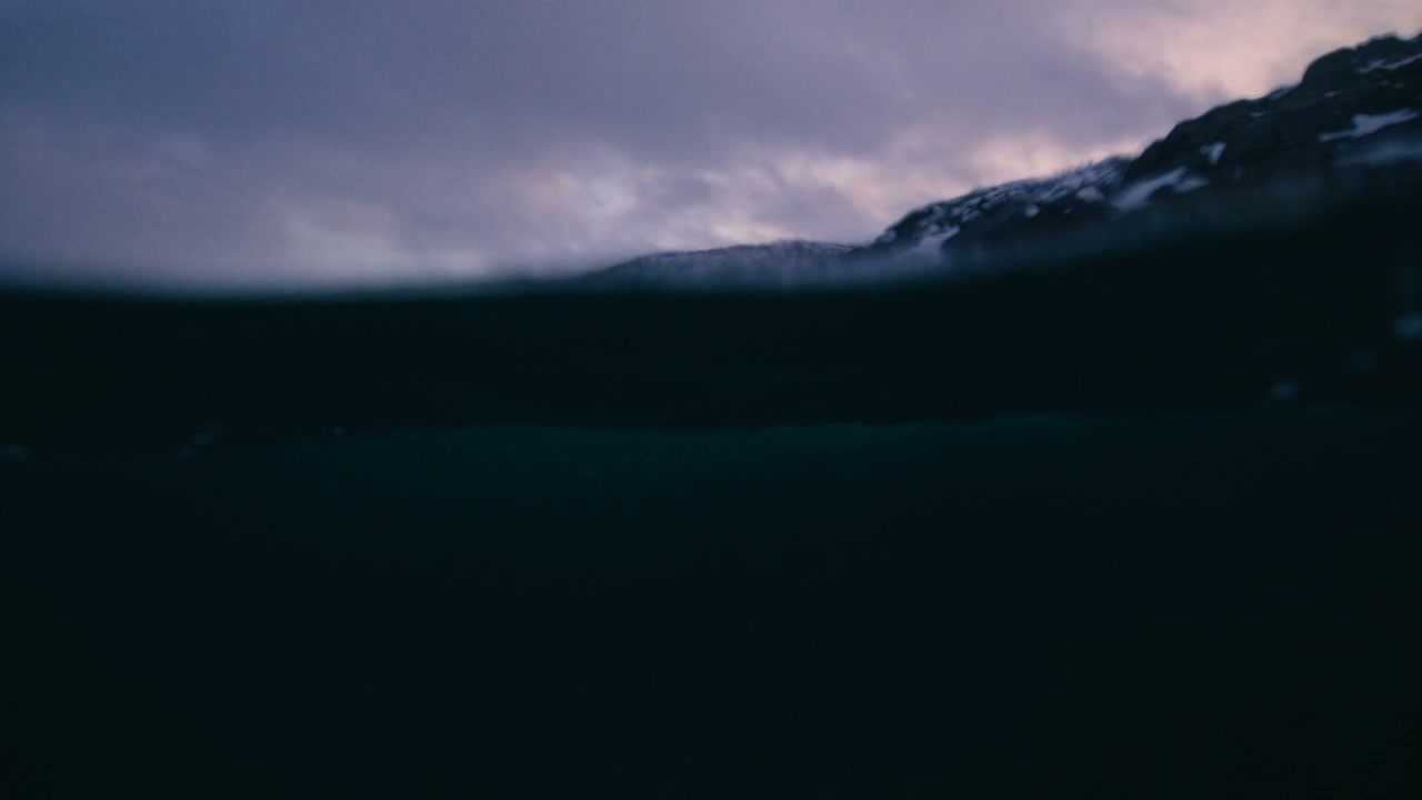Arctic Ocean Waves and Snowy Mountain Landscape
