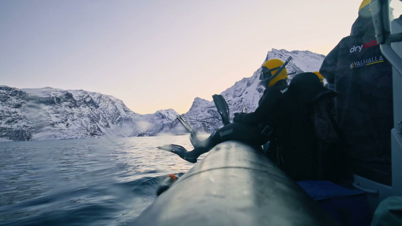 Diver in Wetsuit on Boat in Arctic Fjord
