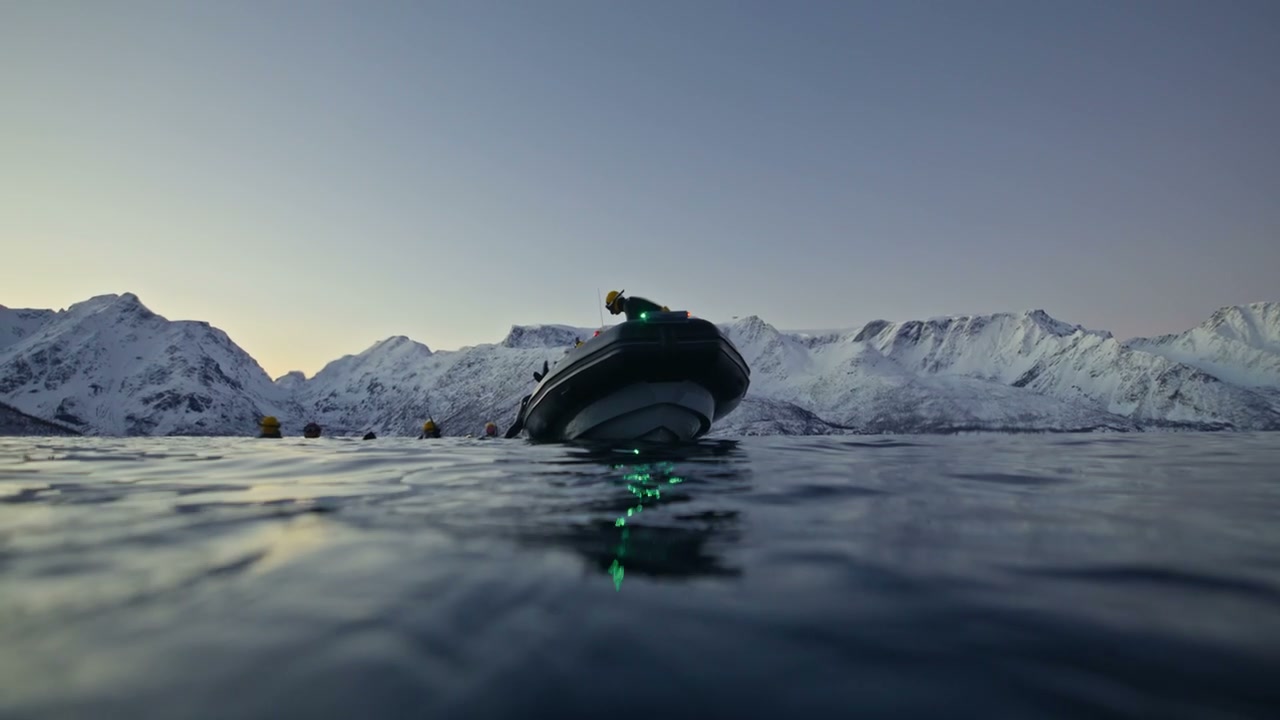 Inflatable Boat in Norwegian Fjord with Divers