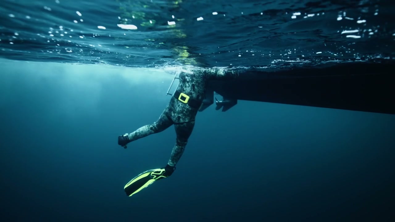 Spearfisher Entering Ocean From Boat