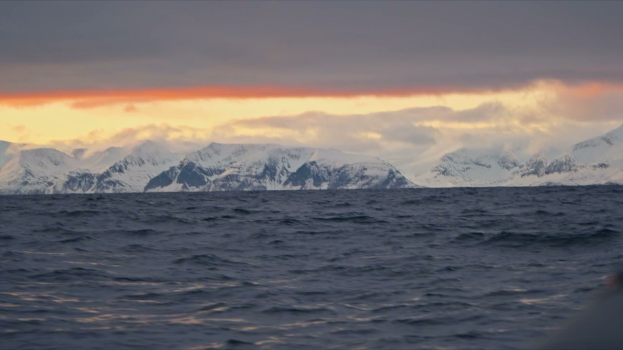 Arctic Ocean and Snowy Norwegian Mountains