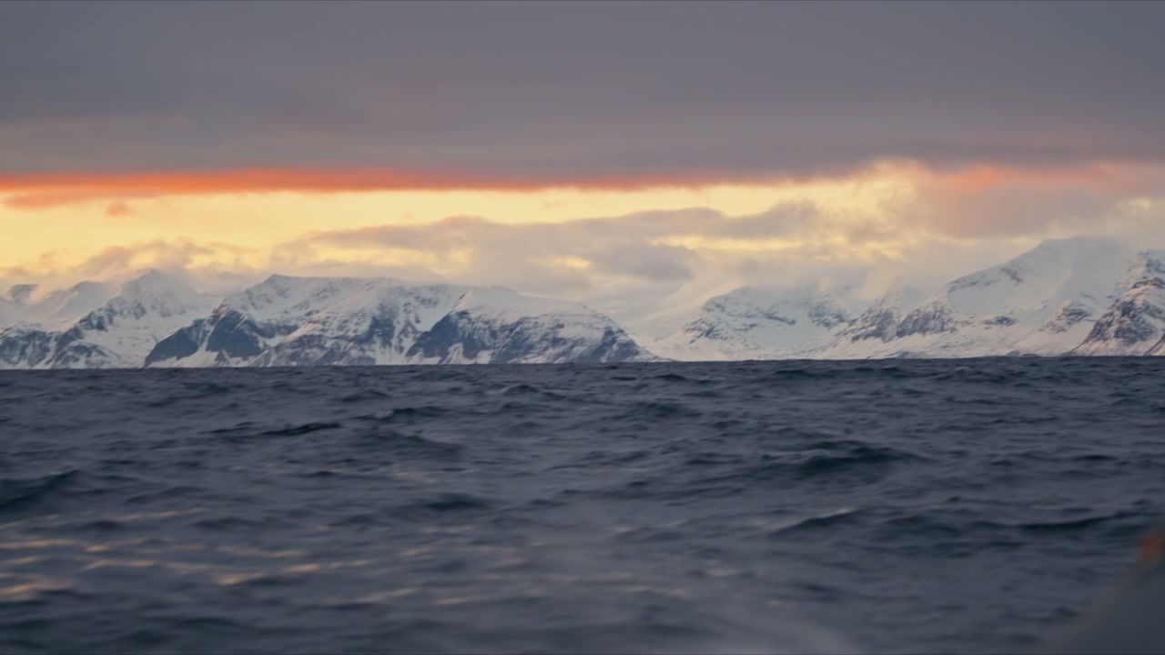 Arctic Ocean Sunset Over Snow-Capped Mountains