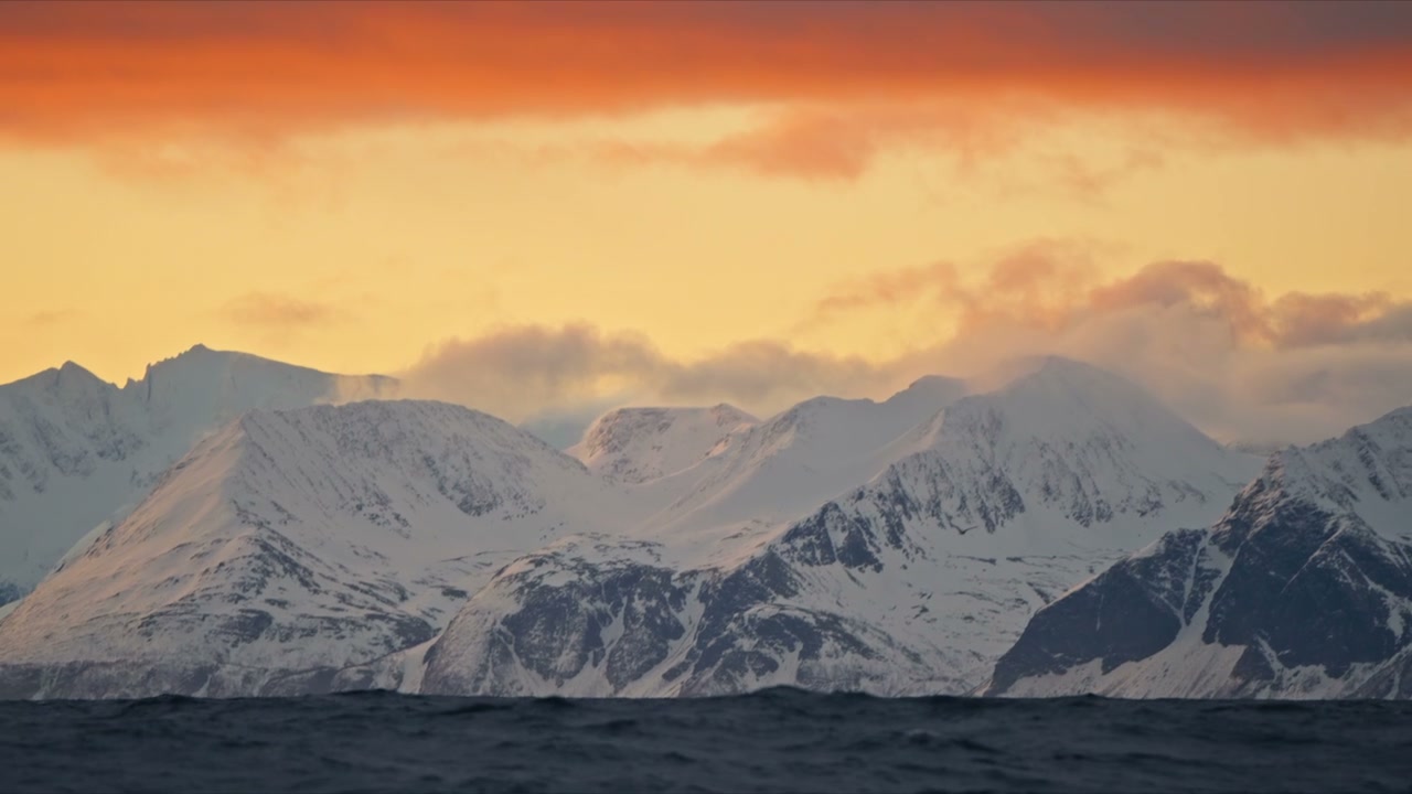 Arctic Mountains Over Choppy Sea at Sunset
