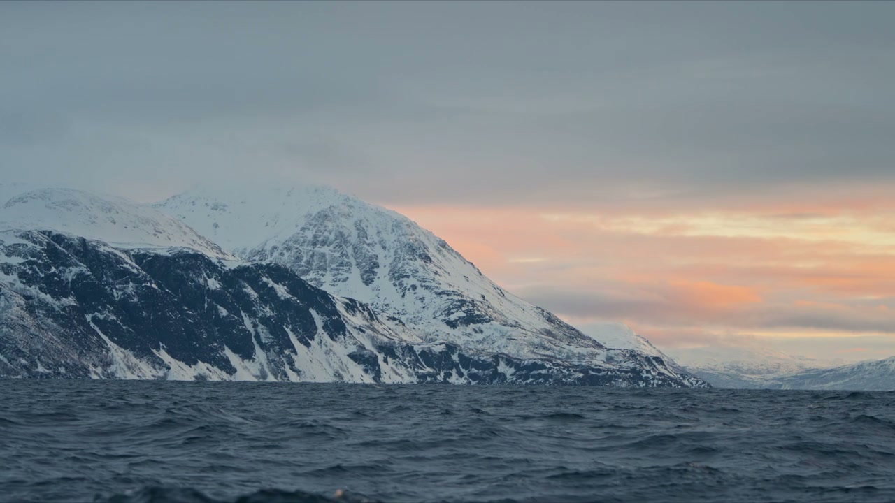 Arctic Fjord with Snow-Capped Mountains at Sunset