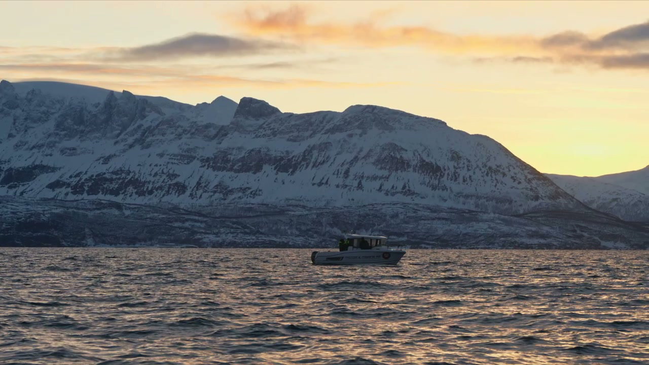 Boat on Arctic Fjord at Sunset