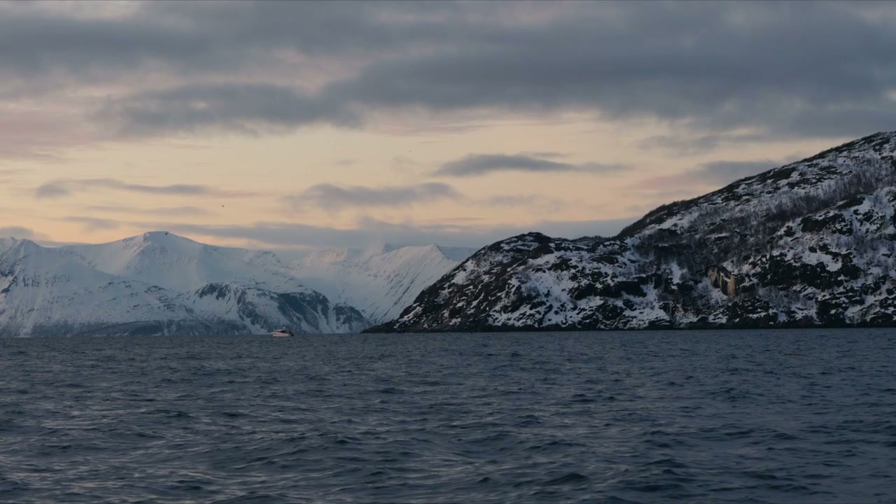 Arctic Fjord with Distant Boat and Snow Mountains