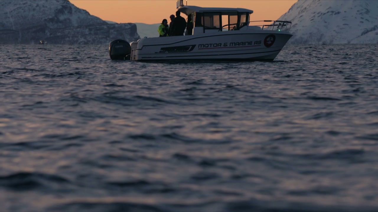 Motorboat With People on Water at Sunset