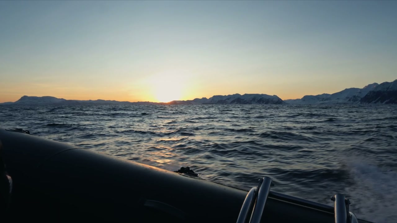 RIB Boat on Arctic Ocean at Sunset
