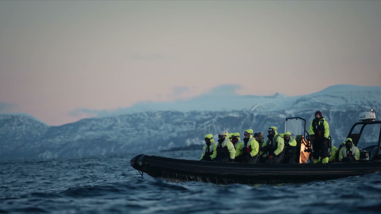 People on RIB Boat in Arctic Fjord