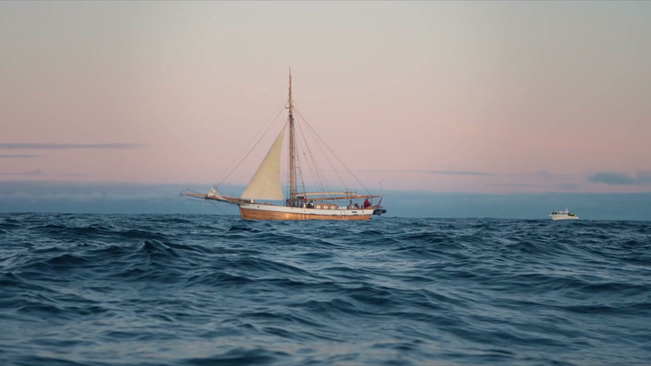 Sailing Ship on Choppy Arctic Sea at Dusk