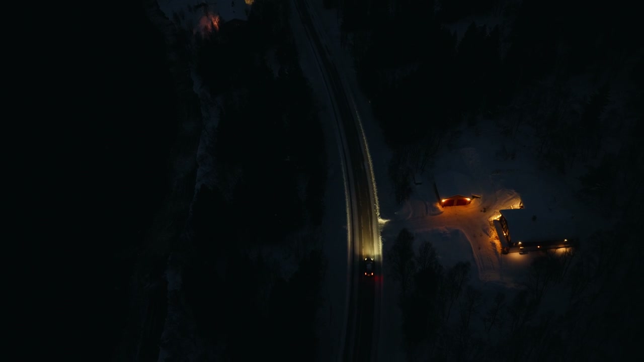 Aerial View of Car on Arctic Winter Road
