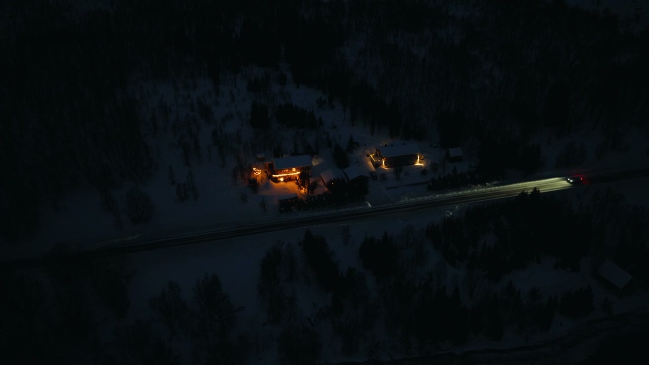 Car Driving on Snowy Road in Norway at Night