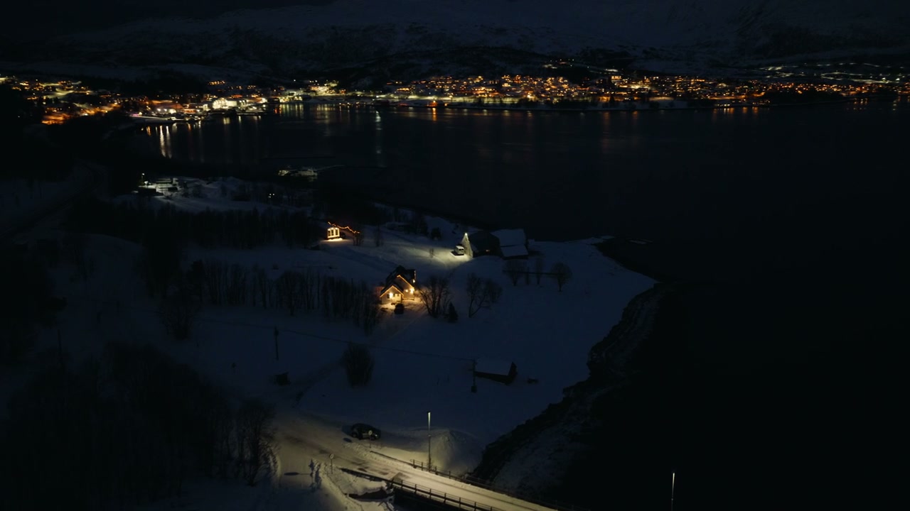Arctic Village Lights by Fjord at Night