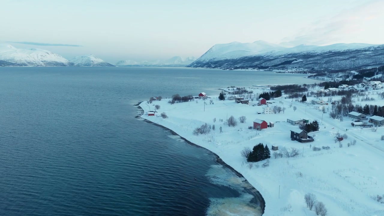 Snowy Village by Norwegian Fjord Coast