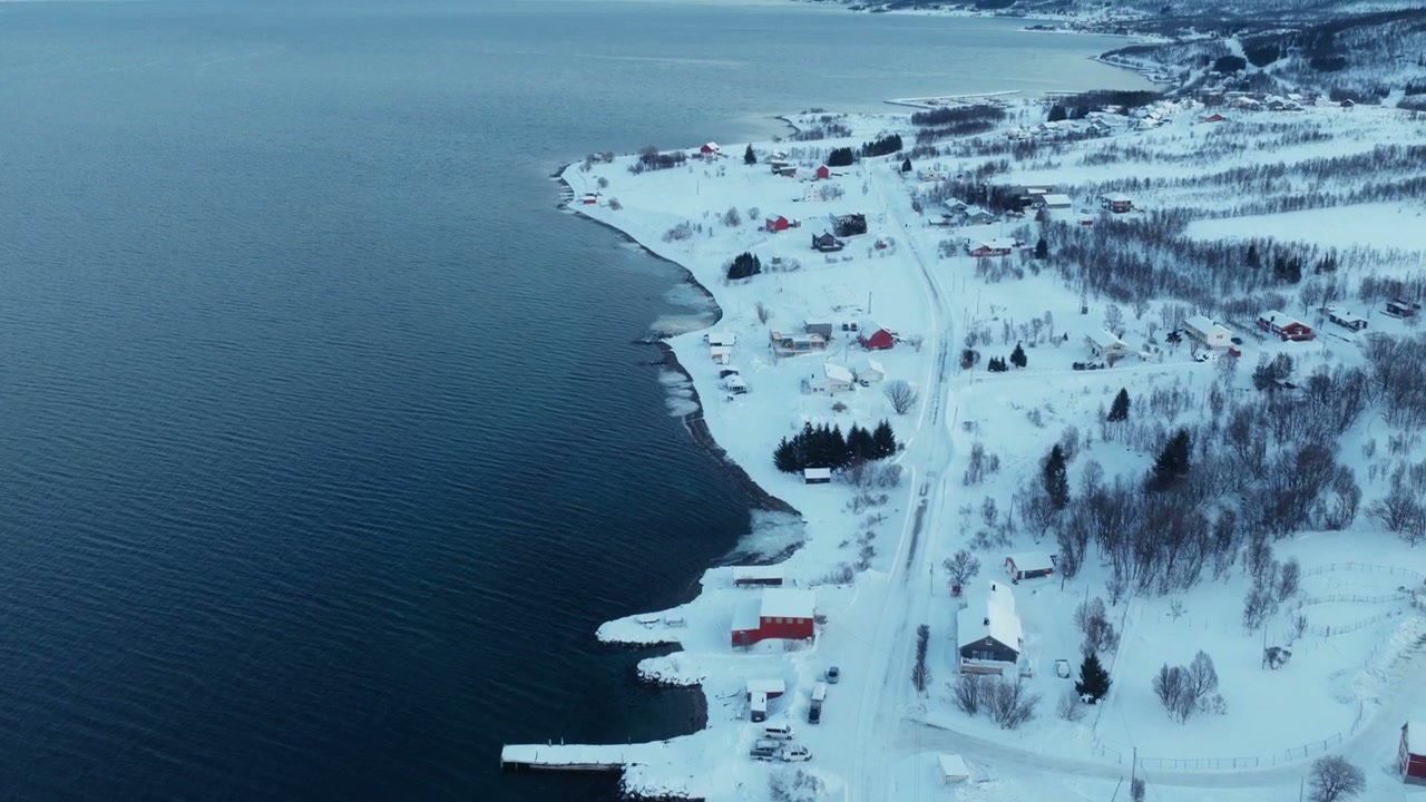 Aerial View of Snowy Arctic Fjord Village