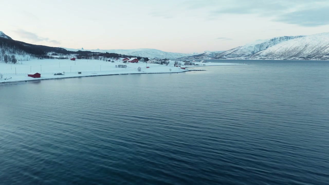 Arctic Fjord with Red Cabins and Snow