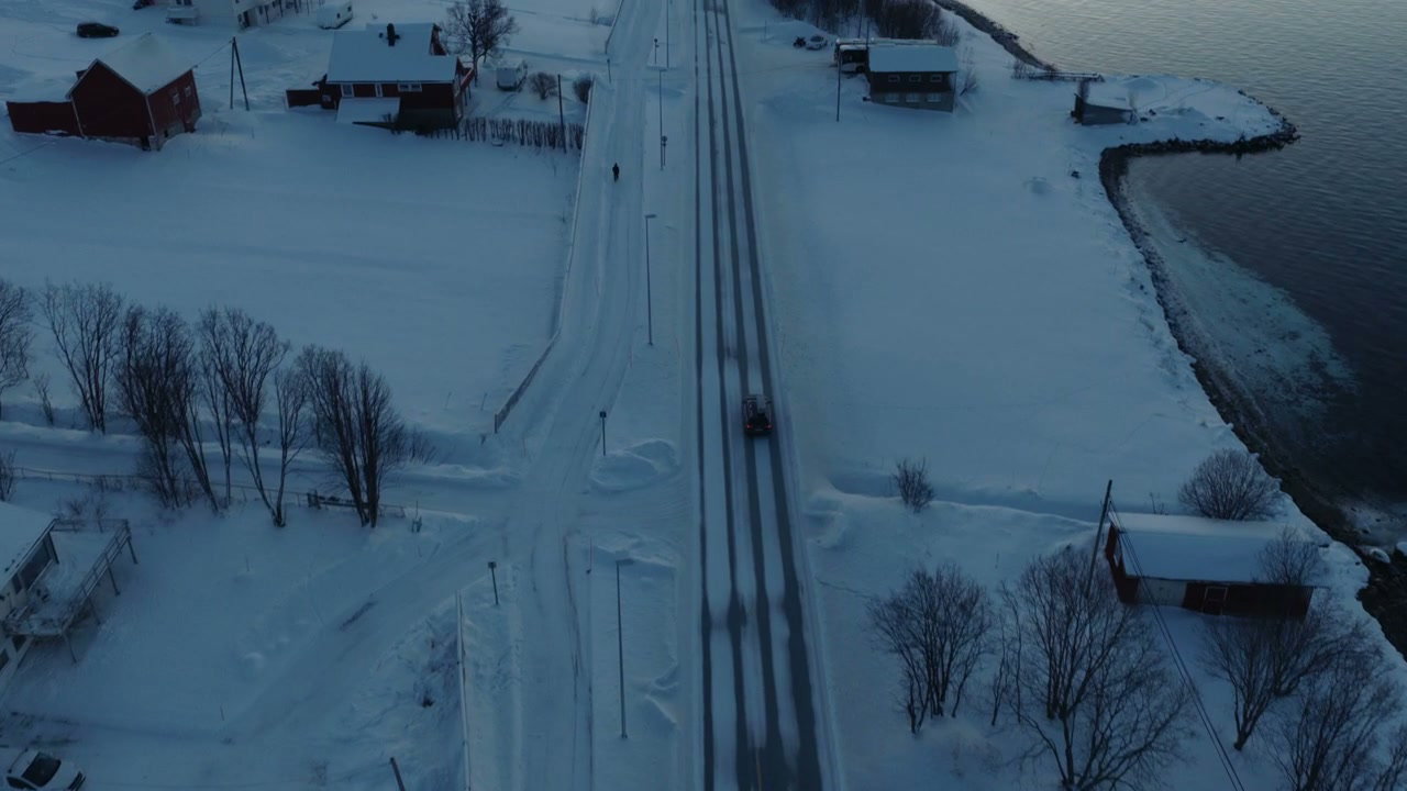 Snowplow Clearing Snowy Road in Arctic Norway