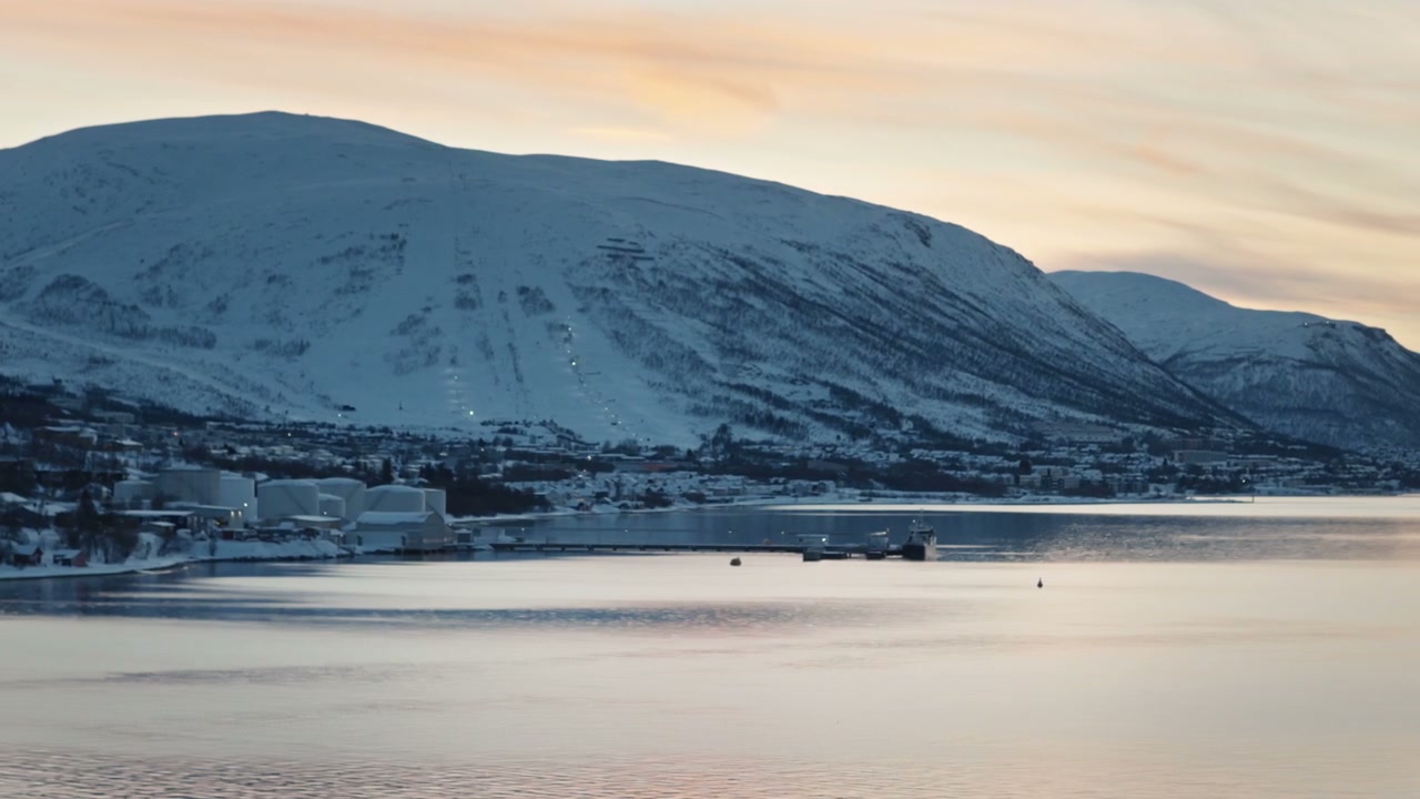 Arctic Fjord With Snowy Mountains and Coastal Town