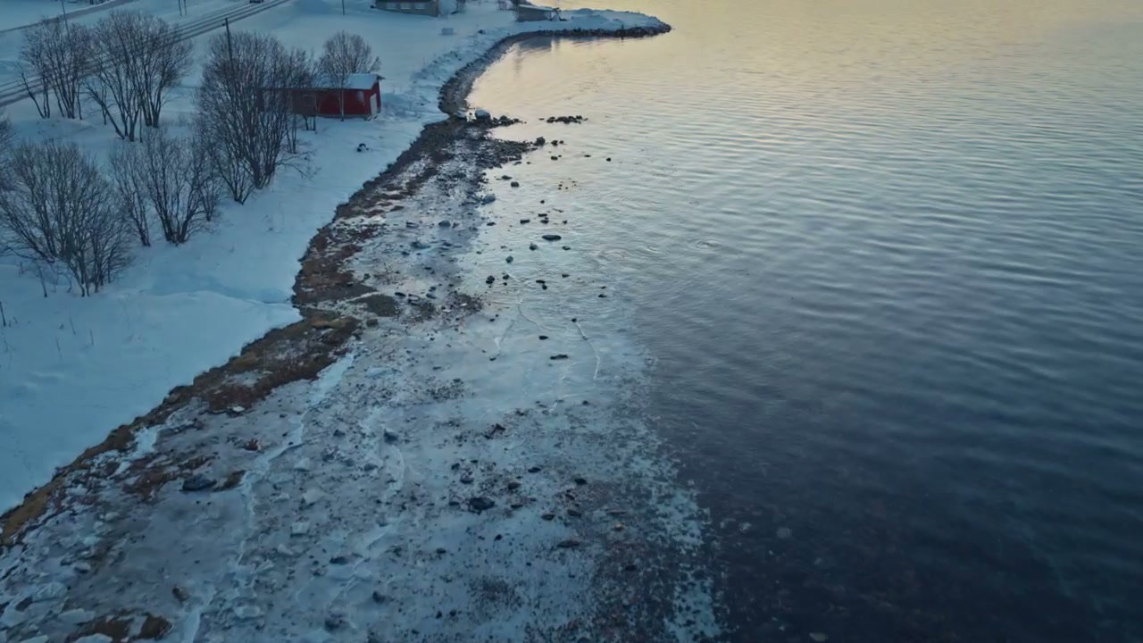 Snowy Fjord Coastline with Arctic Mountains